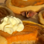 Homemade pumpkin pie cookies with creamy pumpkin filling and whipped cream